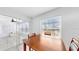 Simple dining area with a wooden table and access to a sunroom at 1006 Plantation Dr # F12, Kissimmee, FL 34741
