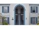 View of the building's exterior with stairs leading to the upper units at 1006 Plantation Dr # F12, Kissimmee, FL 34741