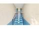 A well-lit stairway leads to the apartment units at 1006 Plantation Dr # F12, Kissimmee, FL 34741