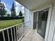 Balcony with sliding glass doors overlooking green space at 11562 Westwood Blvd # 914, Orlando, FL 32821