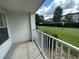 Balcony with white railing and a view of green grass and other buildings at 11562 Westwood Blvd # 914, Orlando, FL 32821