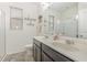 Stylish bathroom with double vanity, dark cabinets, and modern fixtures at 13512 Fallspark Way, Orlando, FL 32824