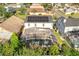 Aerial view of house featuring solar panels and screened-in pool at 2430 Berkshire Ct, Kissimmee, FL 34746