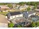 Aerial view showing home with solar panels and pool area at 2430 Berkshire Ct, Kissimmee, FL 34746