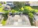 Aerial view of home with solar panels and screened pool at 2430 Berkshire Ct, Kissimmee, FL 34746