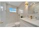 Elegant bathroom with marble tile, a walk-in shower, and modern fixtures at 2430 Berkshire Ct, Kissimmee, FL 34746