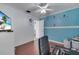 bedroom with blue walls, wood floors, and ample space at 2430 Berkshire Ct, Kissimmee, FL 34746