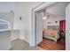 Main bedroom with hardwood floors and ensuite bathroom at 2430 Berkshire Ct, Kissimmee, FL 34746