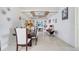 Bright dining room featuring a large table and access to the living room at 2430 Berkshire Ct, Kissimmee, FL 34746