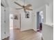 Upstairs hallway with light walls and wood-look flooring at 2430 Berkshire Ct, Kissimmee, FL 34746
