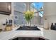 Modern kitchen features a corner sink, white countertops, and a large window at 2430 Berkshire Ct, Kissimmee, FL 34746