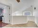 Open loft area with hardwood floors and a view to the lower level at 2430 Berkshire Ct, Kissimmee, FL 34746