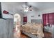 Spacious main bedroom with wood floors, ceiling fan and ensuite bathroom at 2430 Berkshire Ct, Kissimmee, FL 34746