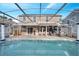 Large refreshing pool with a spacious screened enclosure and patio at 2430 Berkshire Ct, Kissimmee, FL 34746