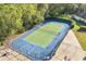 Tennis and basketball court with blue fencing at 2430 Berkshire Ct, Kissimmee, FL 34746