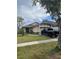 One-story home showcasing a well-maintained lawn and driveway at 425 Blue Jacket Ln, Orlando, FL 32825