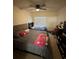 Bedroom featuring two beds, a ceiling fan, and a large window at 4320 S Kirkman Rd # 1513, Orlando, FL 32811