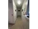 Inviting hallway leading to bedrooms and bathroom, with charming wall decor at 4368 S Kirkman Rd # 201, Orlando, FL 32811