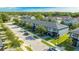 Aerial view of townhouses with a modern design and lush landscaping at 4414 Le Reve Ct, Kissimmee, FL 34746