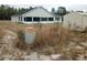 Home's backyard with shed and unkempt grass at 4430 Sw 177Th St, Ocala, FL 34473