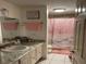 Bathroom with pink and white decor, shower, and single vanity at 508 Orange Dr # 20, Altamonte Springs, FL 32701