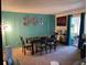 Dining area with table, chairs, and teal accent wall at 508 Orange Dr # 20, Altamonte Springs, FL 32701