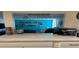 View of the kitchen pass-through to the living room at 508 Orange Dr # 20, Altamonte Springs, FL 32701