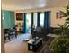 Living room with a sectional sofa, dining table, and teal accents at 508 Orange Dr # 20, Altamonte Springs, FL 32701