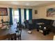 Open-concept living and dining area with sliding glass doors to a balcony at 508 Orange Dr # 20, Altamonte Springs, FL 32701