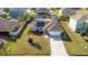 An aerial shot of the property, showcasing the home, driveway, and surrounding neighborhood at 622 Parakeet Ct, Kissimmee, FL 34759