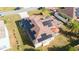 Elevated view of the backyard, featuring solar panels and a patio area at 622 Parakeet Ct, Kissimmee, FL 34759