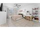 Cozy bedroom featuring a ceiling fan, vanity area, and neutral decor at 622 Parakeet Ct, Kissimmee, FL 34759