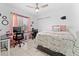 Bedroom with a double bed, desk, chair, and decorative bedding at 622 Parakeet Ct, Kissimmee, FL 34759