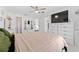 Well-lit main bedroom with ceiling fan, dresser, and a comfortable bed at 622 Parakeet Ct, Kissimmee, FL 34759