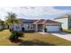 Elevated view of the home's front exterior, showcasing its landscaping at 622 Parakeet Ct, Kissimmee, FL 34759