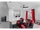 Living room featuring two gaming chairs, a breakfast bar, and sliding glass doors at 622 Parakeet Ct, Kissimmee, FL 34759