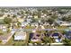 Aerial view pinpointing the home within the neighborhood, highlighting solar panels and surrounding homes at 622 Parakeet Ct, Kissimmee, FL 34759