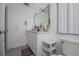 Clean white bathroom with modern vanity, fixtures, and shower/tub combo at 733 Calabria Ave, Davenport, FL 33897