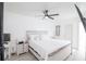 Bright bedroom with white bedding and wooden furniture at 733 Calabria Ave, Davenport, FL 33897