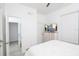Bedroom with white walls, wood-look flooring, and view of en suite bathroom at 733 Calabria Ave, Davenport, FL 33897