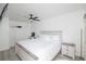 White bedroom with wooden furniture and plenty of natural light at 733 Calabria Ave, Davenport, FL 33897