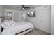 Bright bedroom featuring a king-size bed, mounted TV, and ensuite bathroom access at 733 Calabria Ave, Davenport, FL 33897