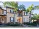 Two-story townhome with balconies and a brick walkway at 733 Calabria Ave, Davenport, FL 33897
