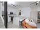 Kitchen with white cabinets, marble countertops, and stainless steel appliances at 733 Calabria Ave, Davenport, FL 33897