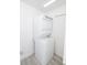 Compact laundry room with stacked washer and dryer at 733 Calabria Ave, Davenport, FL 33897