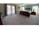 Spacious bedroom with large bed and access to balcony at 842 Sussex Dr, Davenport, FL 33896