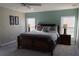 Bright bedroom with king-size bed and ceiling fan at 842 Sussex Dr, Davenport, FL 33896