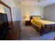 Bedroom with double bed, dresser, and TV at 842 Sussex Dr, Davenport, FL 33896