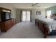 Main bedroom with king-size bed and access to balcony at 842 Sussex Dr, Davenport, FL 33896