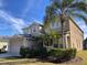 Two-story house with attached garage and landscaping at 842 Sussex Dr, Davenport, FL 33896